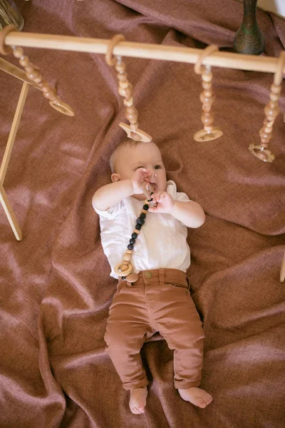 Little Cute Toddler Home Plays Floor Wooden Trainer Brown Jeans — Stock Photo, Image
