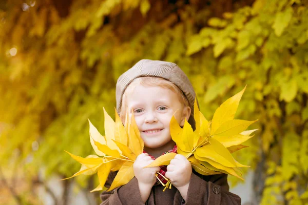 Cute Little Boy Blond Hair Brown Coat Cap Yellow Leaves — ストック写真