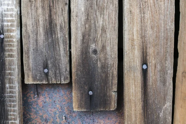 Wooden boards with nails