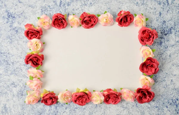 Floral pattern frame made of roses on white and black background. Flat lay, top view. Valentine\'s background. International Woman\'s day , 8 march Pattern of flowers. Flowers pattern texture
