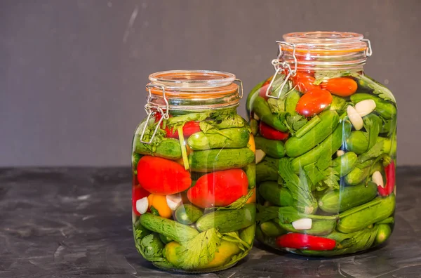 Preserves or pickled vegetables in glass jars. — Stock Photo, Image