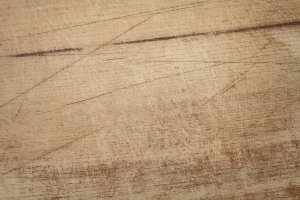 Holzstruktur. die Oberfläche aus braun zerkratztem Holzschneidebrett. Grunge texturierten Holz Hintergrund. — Stockfoto