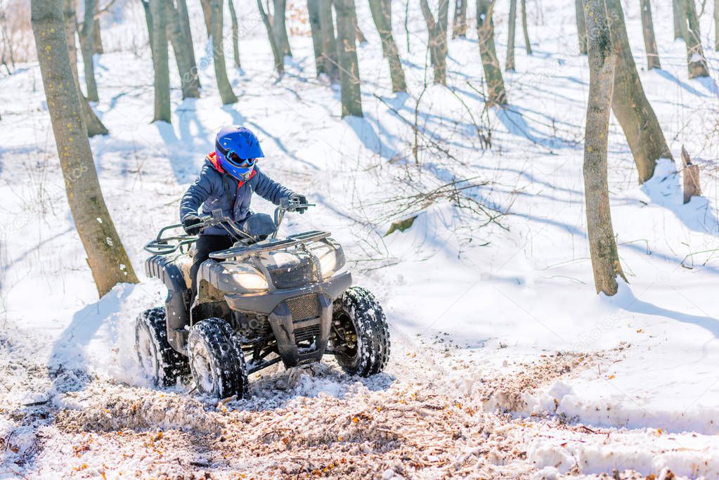 Travel in the winter on the ATV. Beautiful winter nature.