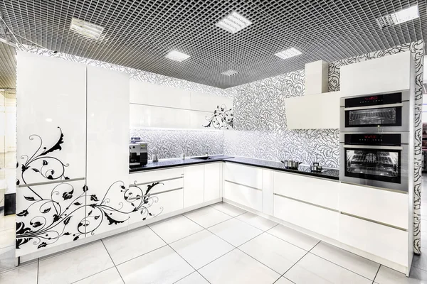 Modern white kitchen furniture. Painted front surface. The material used in the manufacture - MDF
