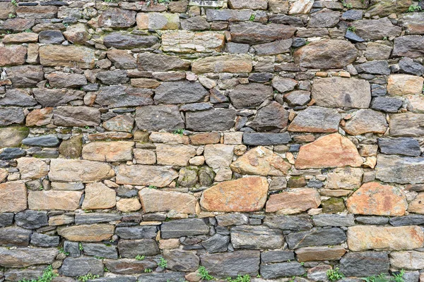 Muralla de piedra medieval, fondo.La muralla de uno de los monasterios de Athos . —  Fotos de Stock