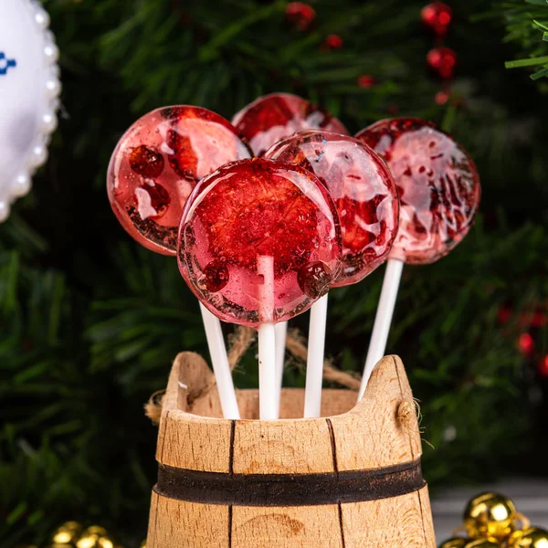 Candy canes, Christmas trees, berries and candy. .Lollipops made from natural fruits and berries. Healthy food and vegetarian food concepts