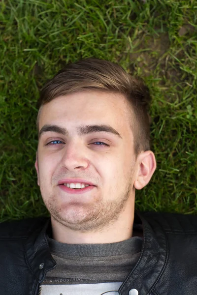 Head Shot Young Man Lying Grass Smiling Close Portrait Overhead — Stock Photo, Image