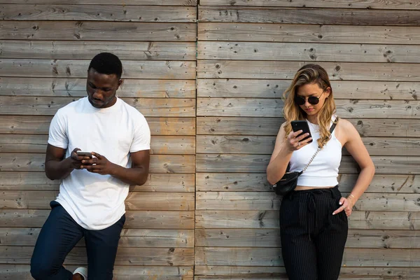 Young Black Man Blond Caucasian Woman Cool Attitudes Looking Phone — Stock Photo, Image