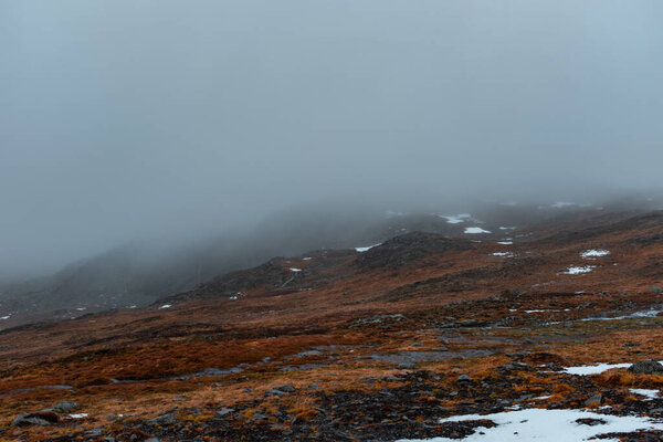 Norwegian landscape terrain with misty background. 