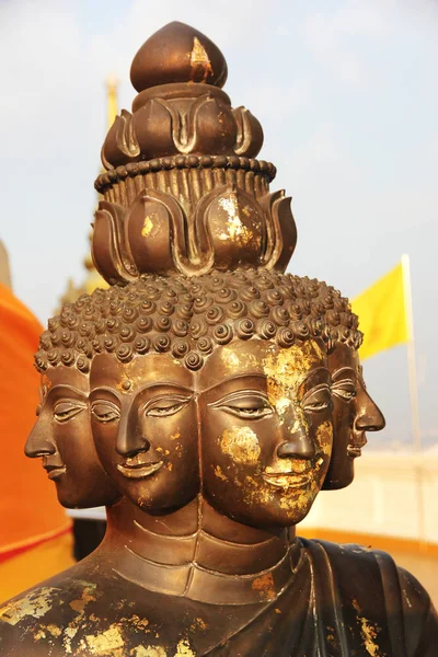 many faces buddha