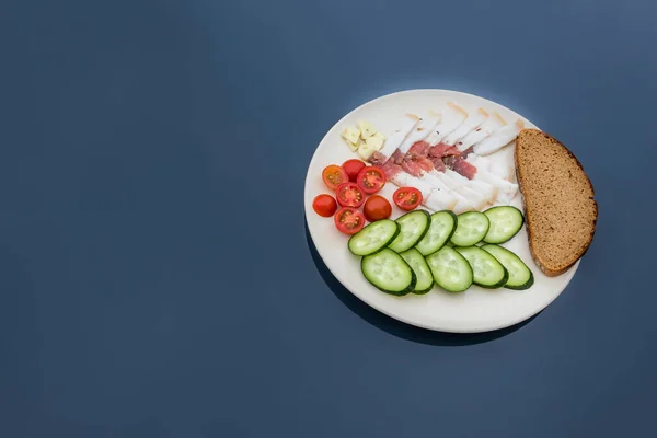 Sliced salted lard served with cucumber, tomato and bread. Traditional Russian snack. Homemade food. Healthy food. Organic ingredients copy space — Stock Image Sliced Salted Lard Served Cucumber Tomato Bread Traditional Russian Snack Royalty Free Stock Images