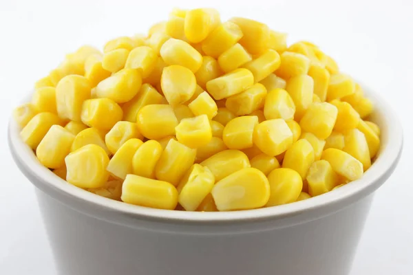 small bowl with pile of corn on white background