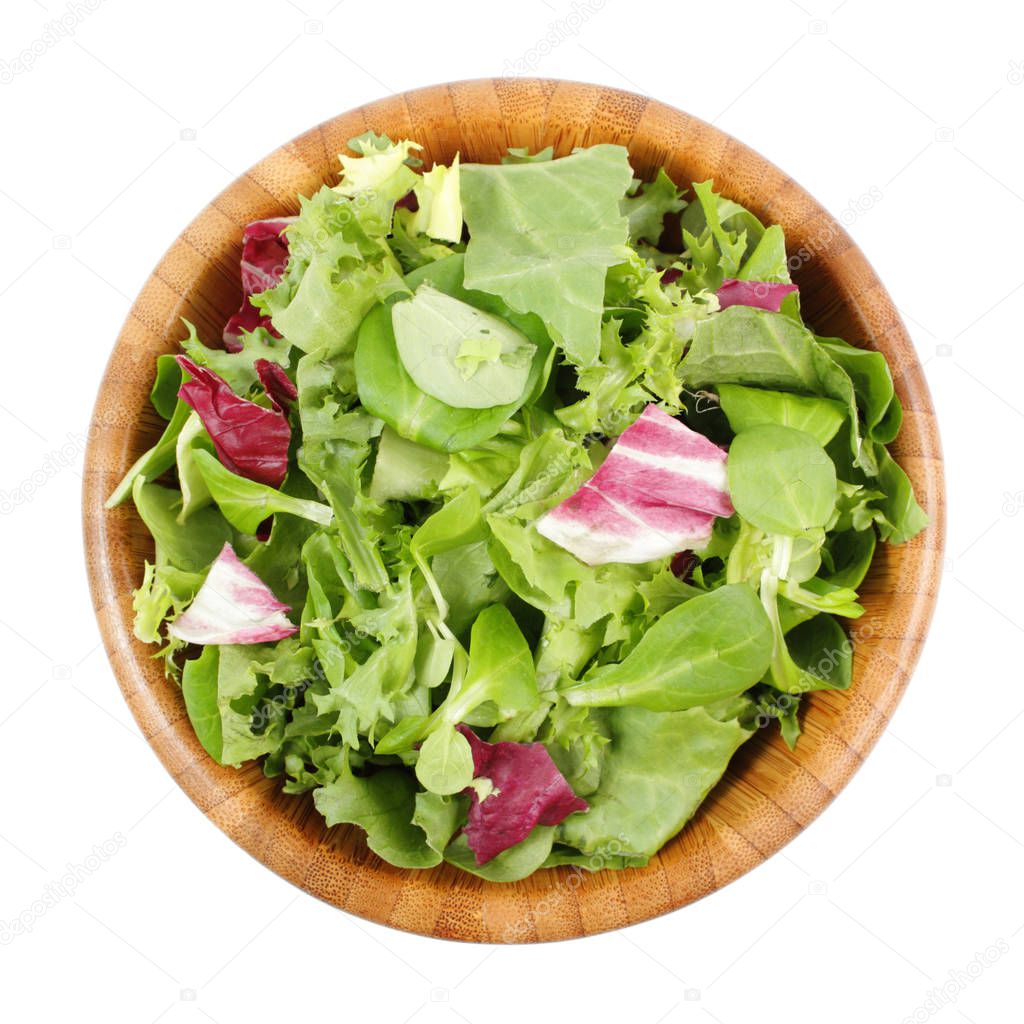 top view of wooden bowl with mix salad leaves on white background