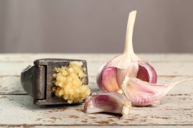 Garlic crushed and garlic press clipart