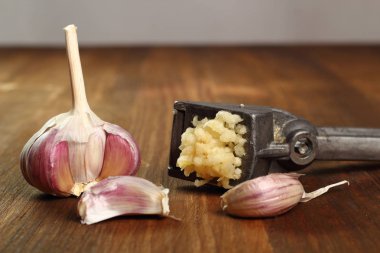 Garlic crushed and garlic press clipart