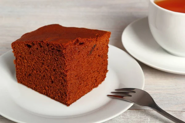 Gingerbread cake with cup of tea