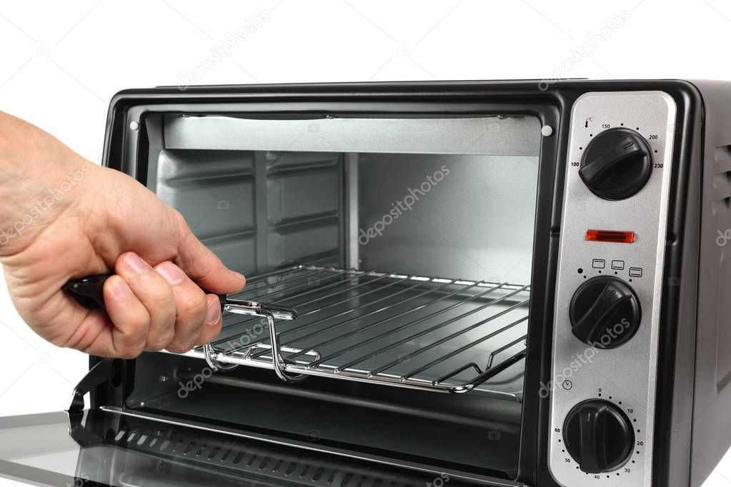 Chef holding grill oven. Isolated with clipping path.