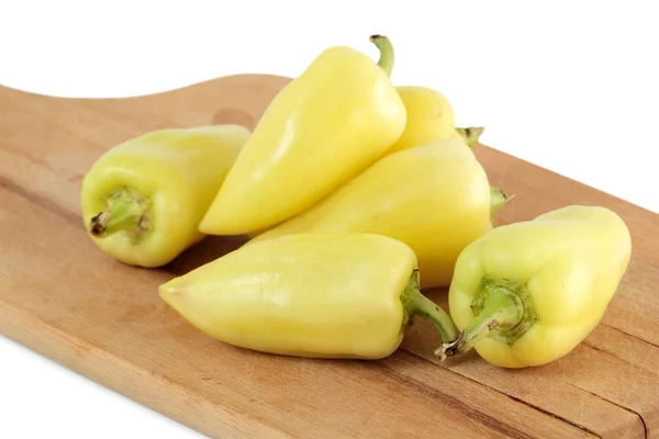 Whole Yellow Peppers Wooden Board Isolated White Background — Stock Photo, Image