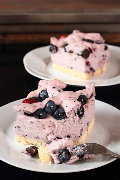 Cold cheesecake with blueberry and strawberry