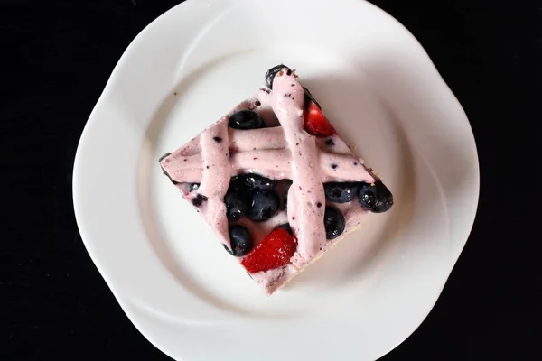 Cold cheesecake with blueberry and strawberry