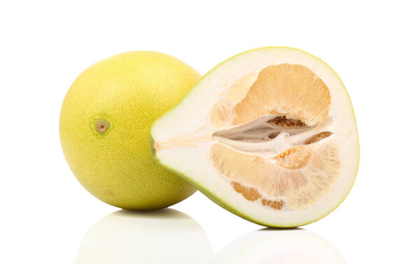 fresh citrus fruit with half on white background