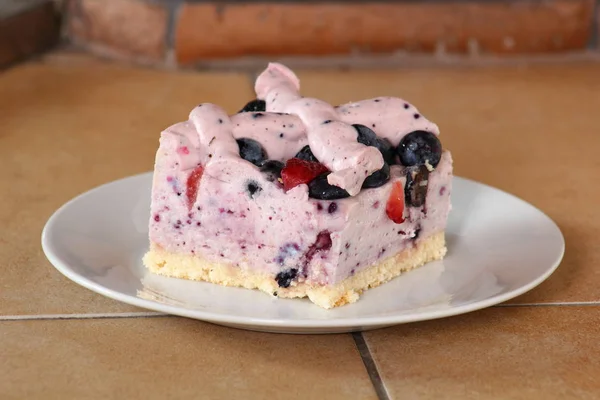 Cold cheesecake with blueberry and strawberry