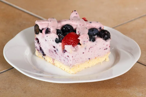 Cold cheesecake with blueberry and strawberry