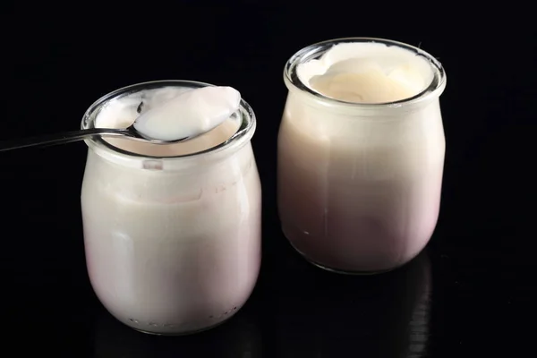 Spoon Yogurt Open Small Glass Jar Black Background — Stock Photo, Image