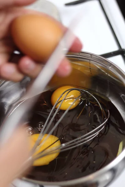 Adding Eggs Pan Melted Chocolate — Stock Photo, Image