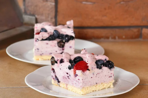 Cold cheesecake with blueberry and strawberry