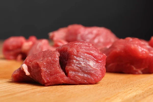 Diced beef casserole steak on cutting board