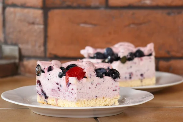 Cold cheesecake with blueberry and strawberry