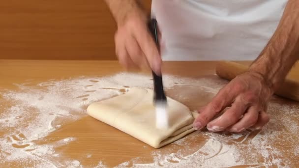 Man Making Puff Pasty — стоковое видео