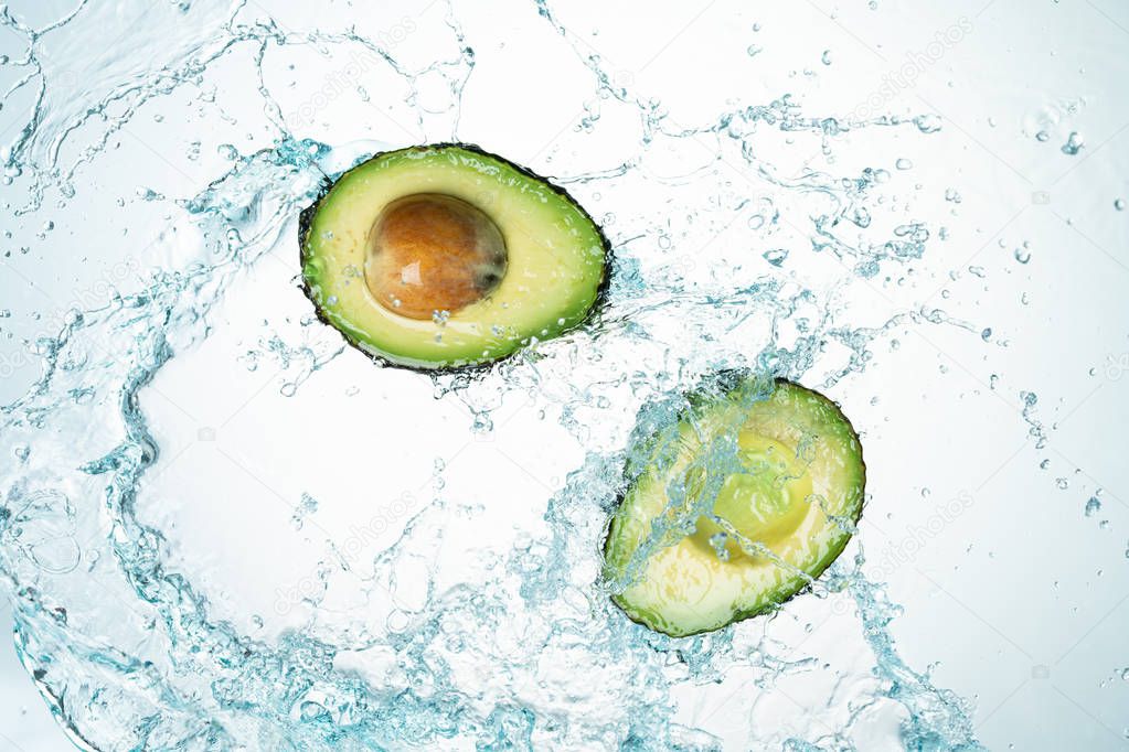 Avocado Water Splash on white background