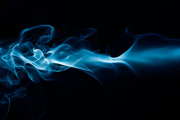 Abstract colored wave smoke on black background