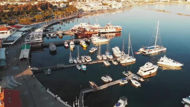 Drone shot of city marina bay with ships, boats and yachts near sea pier in paphos cyprus city before sunset. Aerial shot — Stock Video