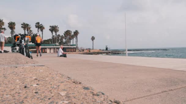 March, 16, 2019/Cyprus, Paphos. Timelapse of beautiful tourist promenade. Tourists walking at pier timelapse video. Timelapse of tourist zone with restaurants and cafes. — Stock Video