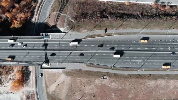 Aerial top view of highway with busy car traffic. Cars and buses riding on roadway. Kyiv, Ukraine. — Stock Video