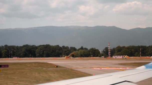 Geneva/Switzerland -July, 22 2019 - airplane taking off in airport Geneve, inside view from porthole — стокове відео