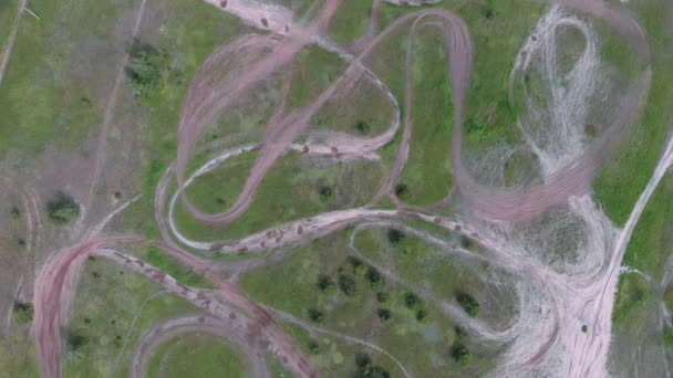 Motocross motorcycle park in forest. Aerial top view of empty professional motocross racetrack. View from drone of motorcycle racetrack in the middle of forest — Stock Video