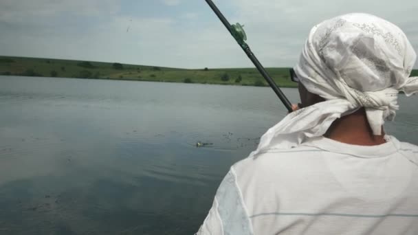 Fisherman caught fish with fishing rod. River fishing. Fishing near  river. Freshly caught fish. Man catching fish on lake — Stock Video