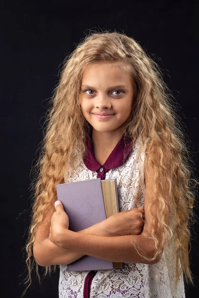 Portrait of a teenage girl with an old book — Stock Photo, Image