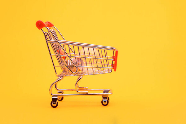 There is a transparent lamp in the grocery cart