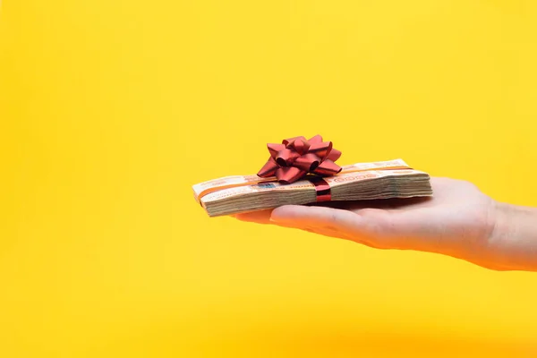 Hand Gives Pack Five Thousandth Bills Yellow Background — Stock Photo, Image