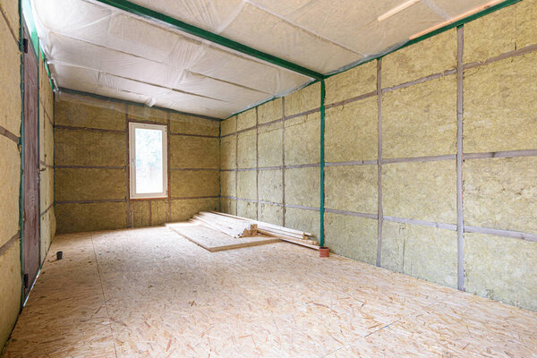 Construction of a small country house, frame insulated with mineral wool