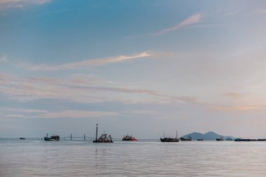 Boats float in the sea against the backdrop of the mountain Penang 
