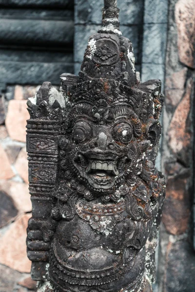 Old weathered religious statue at Bali