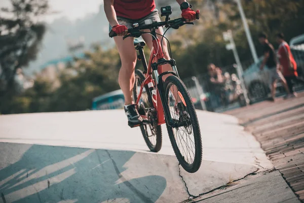 Woman freerider riding down ramps, Sports extreme and active lifestyle