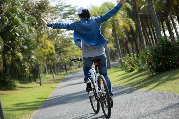 Young Woman Cyclist Riding Bike Raised Hands Tropical Park — Stock Photo, Image