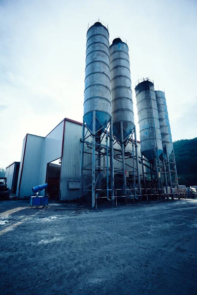 Exterior view of a cement factory. Concrete mixing silo, construction site facilities